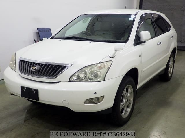 A grey JDM sports car speeding down a highway at night.