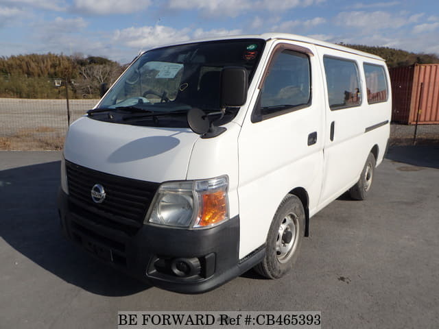 A grey JDM sports car speeding down a highway at night.