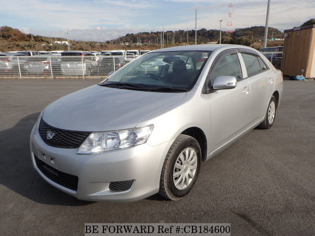 A grey JDM sports car speeding down a highway at night.