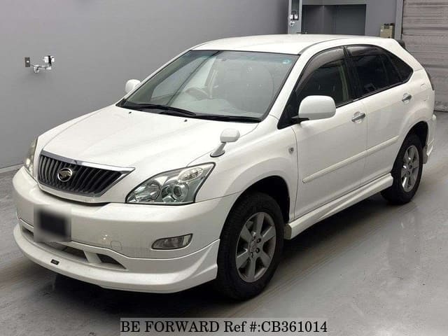 A grey JDM sports car speeding down a highway at night.