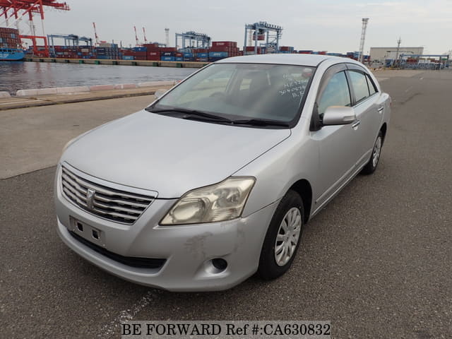 A grey JDM sports car speeding down a highway at night.