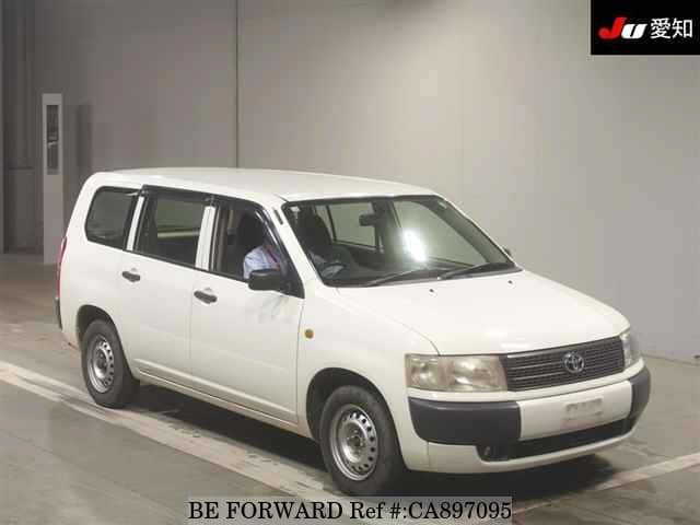 A grey JDM sports car speeding down a highway at night.