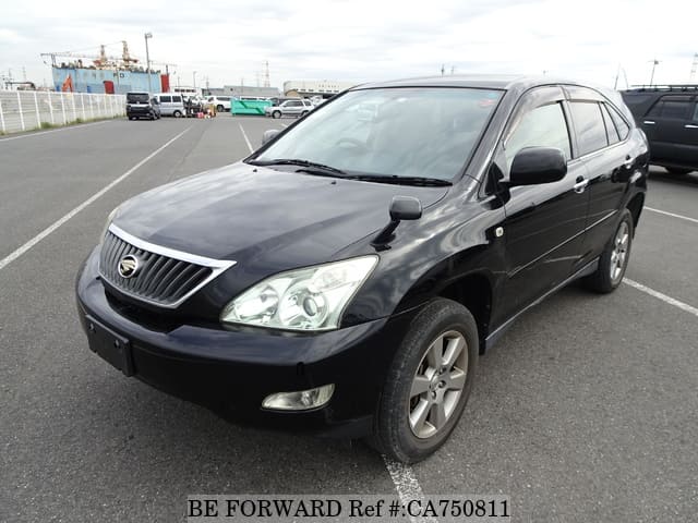 A grey JDM sports car speeding down a highway at night.