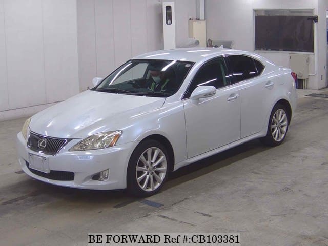 A grey JDM sports car speeding down a highway at night.
