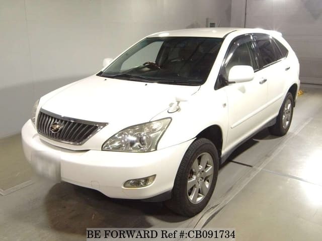 A grey JDM sports car speeding down a highway at night.