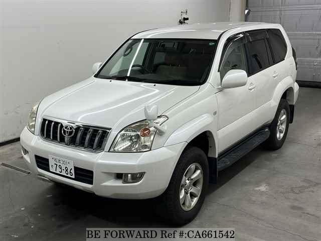 A grey JDM sports car speeding down a highway at night.
