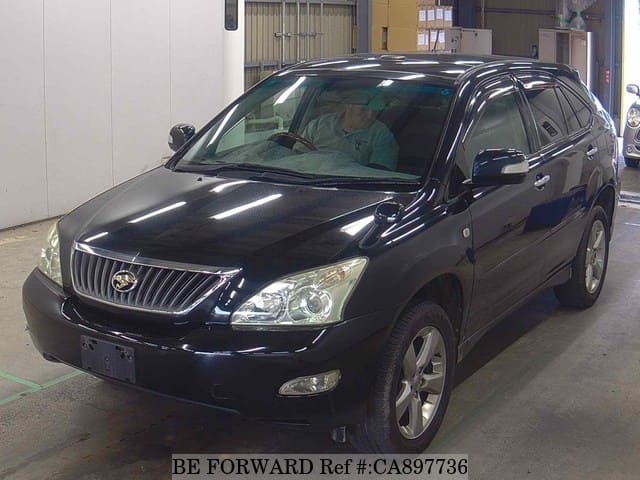 A grey JDM sports car speeding down a highway at night.