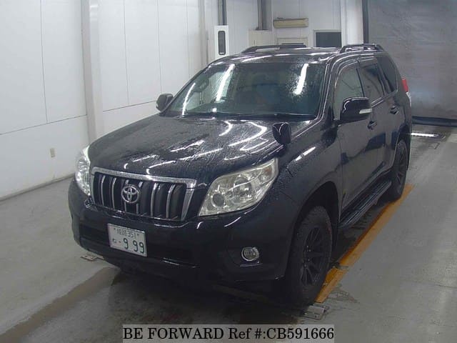 A grey JDM sports car speeding down a highway at night.
