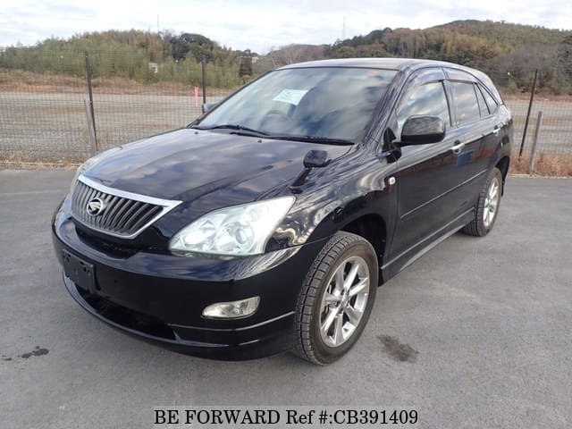 A grey JDM sports car speeding down a highway at night.