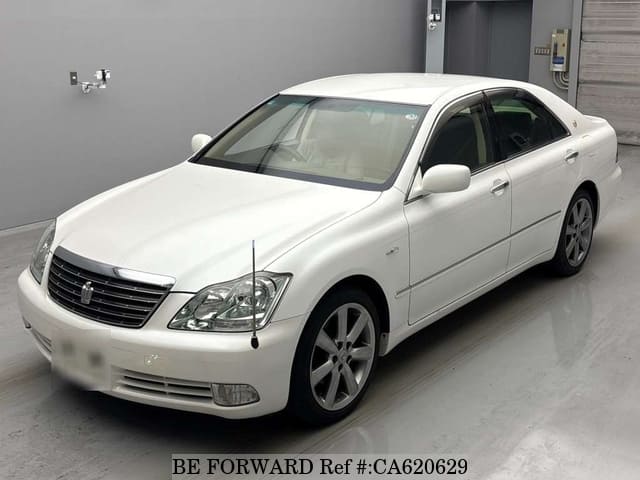 A grey JDM sports car speeding down a highway at night.