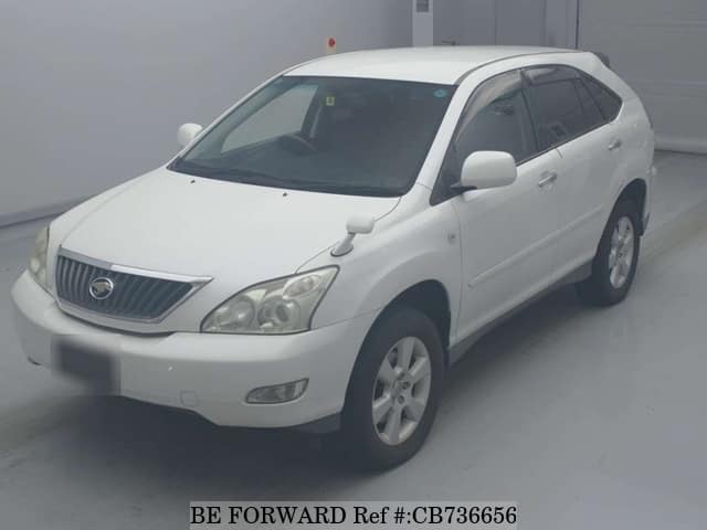 A grey JDM sports car speeding down a highway at night.