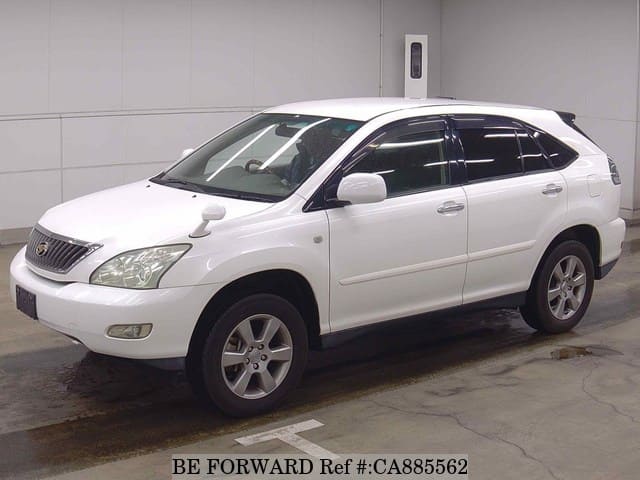 A grey JDM sports car speeding down a highway at night.