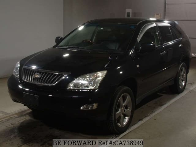 A grey JDM sports car speeding down a highway at night.