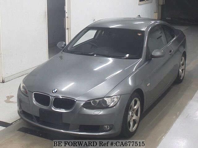 A grey JDM sports car speeding down a highway at night.