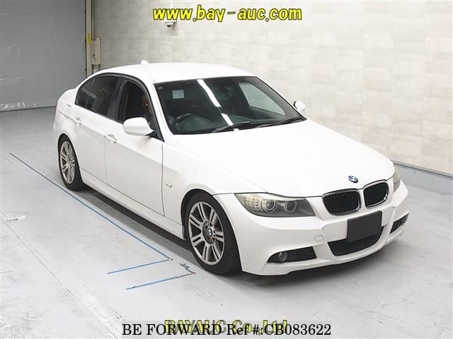 A grey JDM sports car speeding down a highway at night.