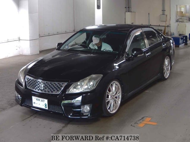 A grey JDM sports car speeding down a highway at night.