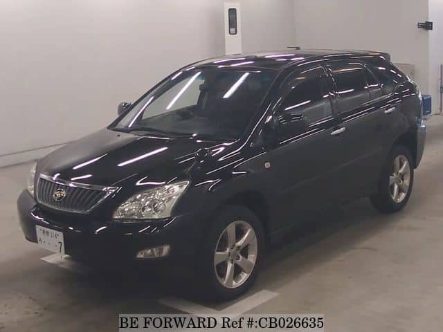 A grey JDM sports car speeding down a highway at night.
