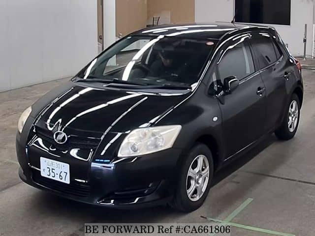 A grey JDM sports car speeding down a highway at night.