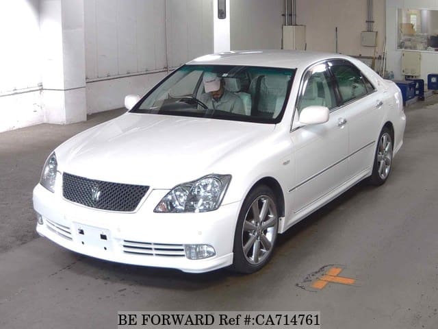 A grey JDM sports car speeding down a highway at night.