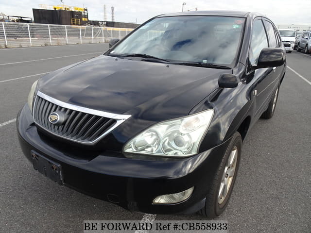 A grey JDM sports car speeding down a highway at night.