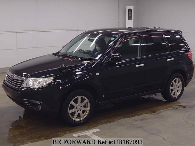 A grey JDM sports car speeding down a highway at night.