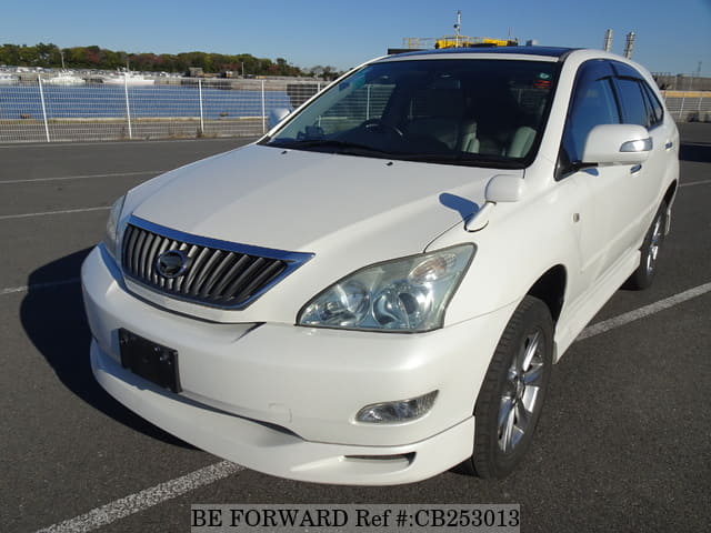 A grey JDM sports car speeding down a highway at night.