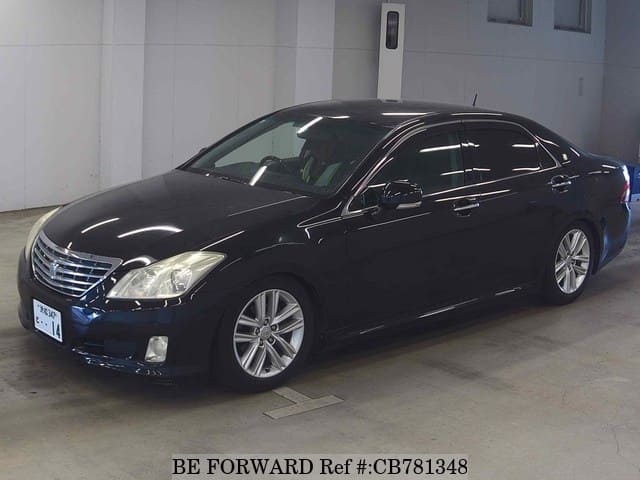 A grey JDM sports car speeding down a highway at night.