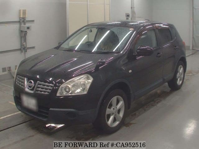 A grey JDM sports car speeding down a highway at night.