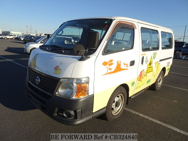A grey JDM sports car speeding down a highway at night.