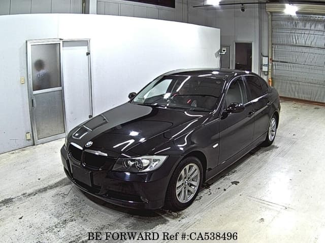 A grey JDM sports car speeding down a highway at night.