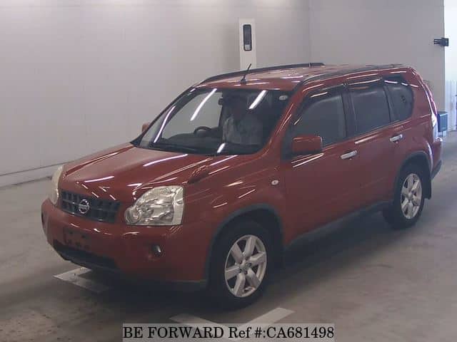 A grey JDM sports car speeding down a highway at night.
