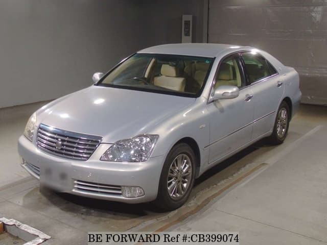 A grey JDM sports car speeding down a highway at night.