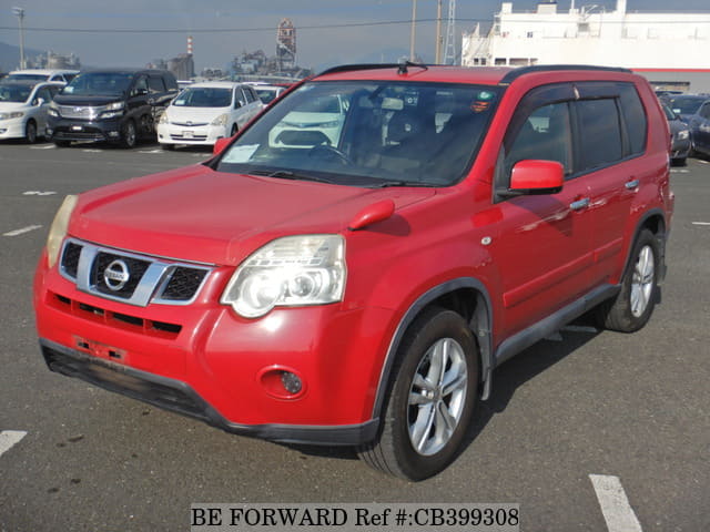 A grey JDM sports car speeding down a highway at night.
