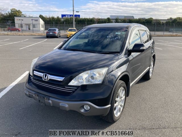 A grey JDM sports car speeding down a highway at night.