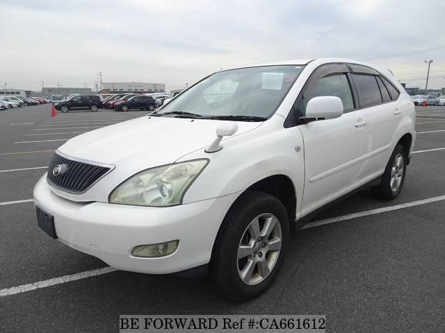 A grey JDM sports car speeding down a highway at night.