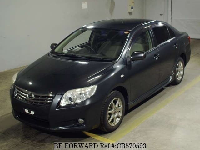 A grey JDM sports car speeding down a highway at night.