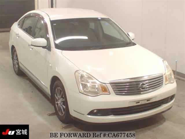 A grey JDM sports car speeding down a highway at night.