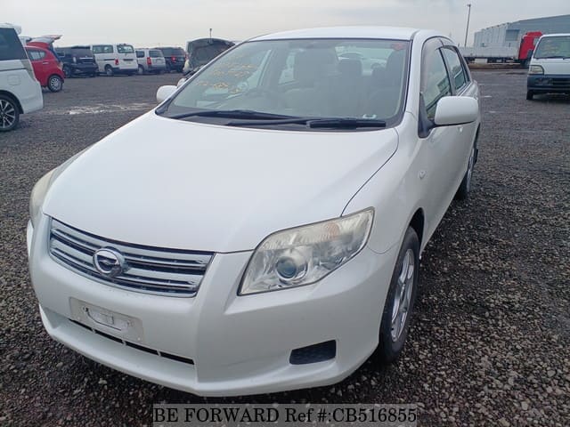 A grey JDM sports car speeding down a highway at night.