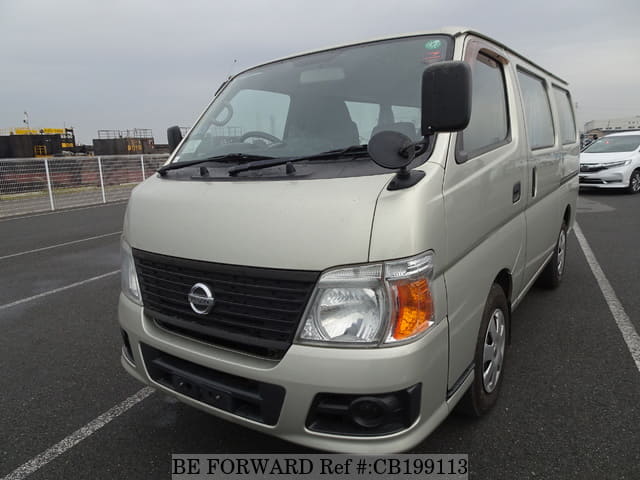 A grey JDM sports car speeding down a highway at night.