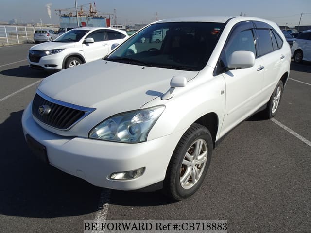 A grey JDM sports car speeding down a highway at night.