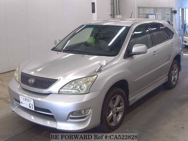 A grey JDM sports car speeding down a highway at night.