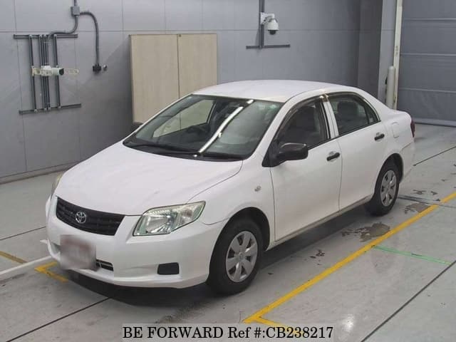 A grey JDM sports car speeding down a highway at night.