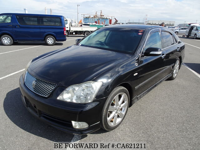 A grey JDM sports car speeding down a highway at night.