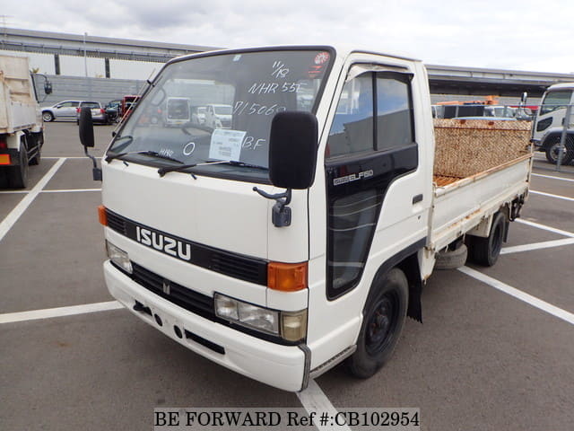 A grey JDM sports car speeding down a highway at night.