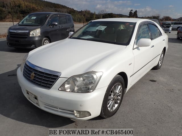 A grey JDM sports car speeding down a highway at night.