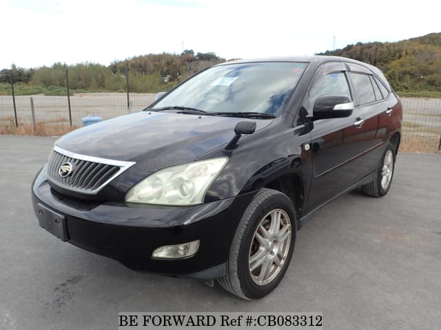 A grey JDM sports car speeding down a highway at night.