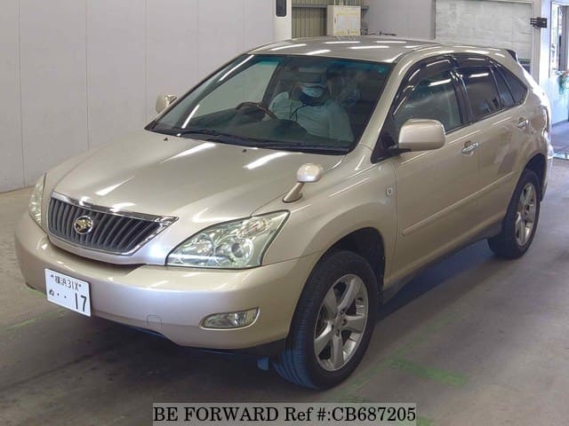 A grey JDM sports car speeding down a highway at night.