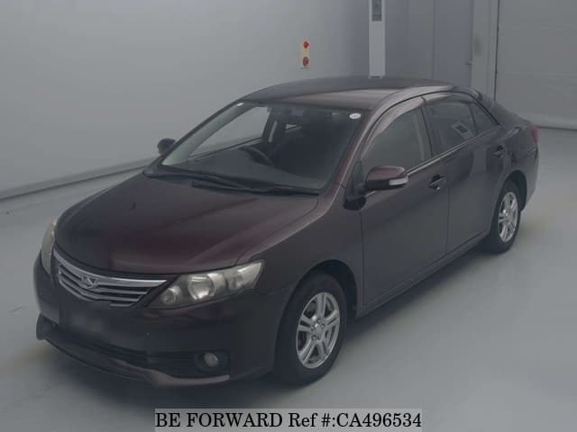 A grey JDM sports car speeding down a highway at night.