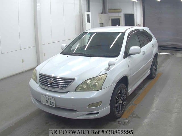 A grey JDM sports car speeding down a highway at night.