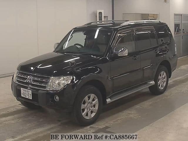 A grey JDM sports car speeding down a highway at night.